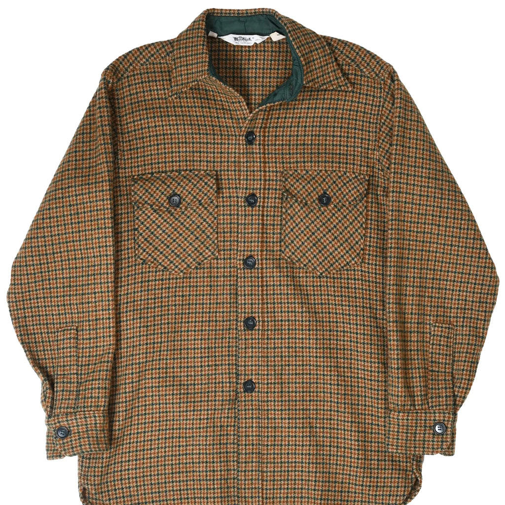 Front of Woolrich brown and green plaid wool shirt with button-flap chest pockets