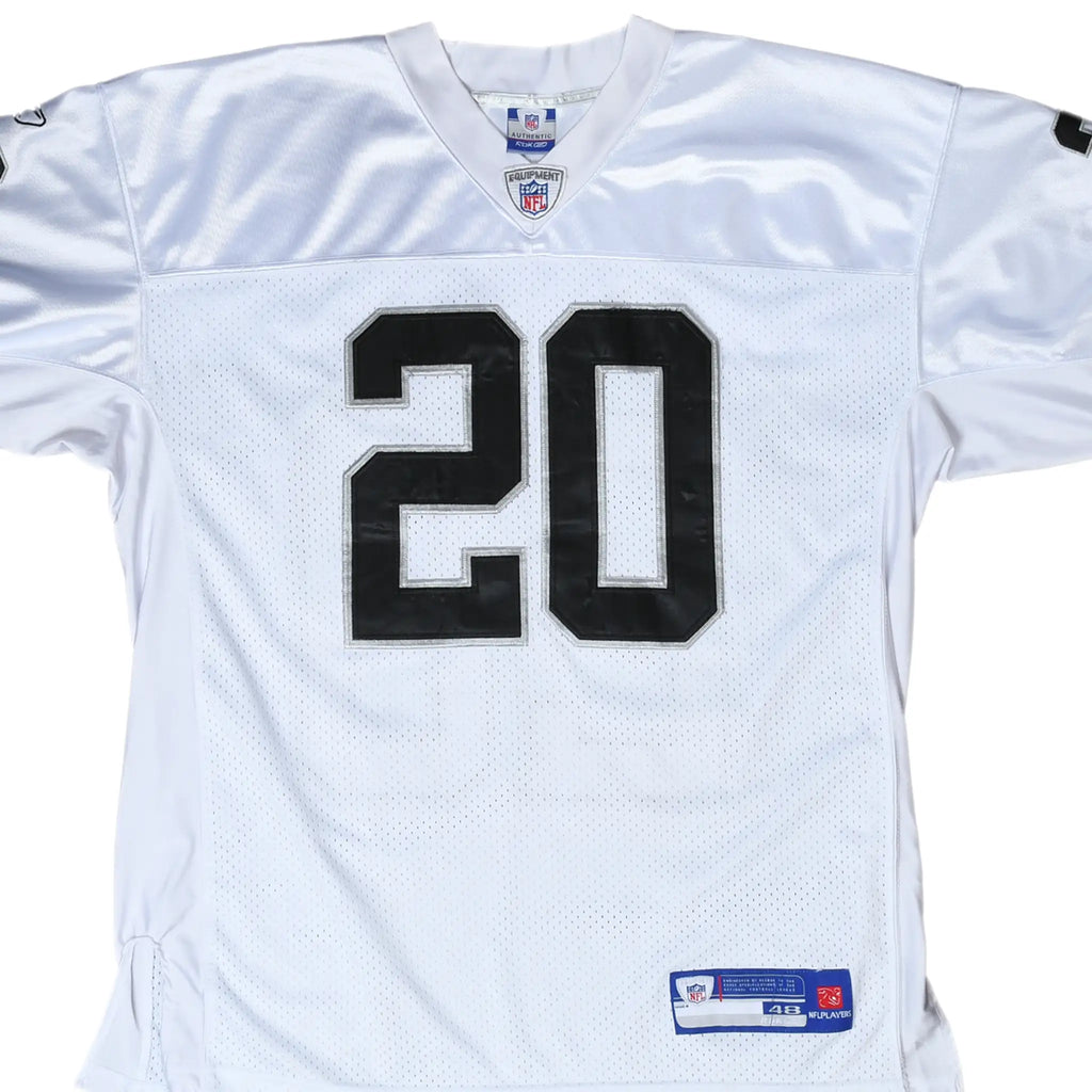 Front close-up of white Reebok Oakland Raiders jersey with black number 20