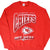 Front of red Kansas City Chiefs sweatshirt with arrowhead logo and AFC West graphic