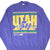 Front of purple Utah Jazz sweatshirt with oversized yellow, green and white team graphic