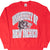 Front of red University of New Mexico Lobos sweatshirt with wolf mascot graphic