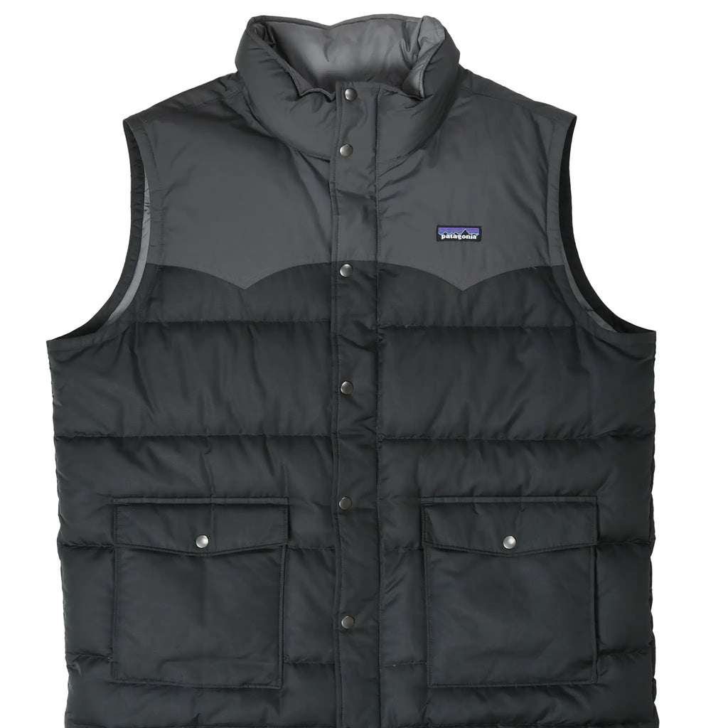 Front of black Patagonia Slingshot down vest with gray Western yoke and snap-flap cargo pockets