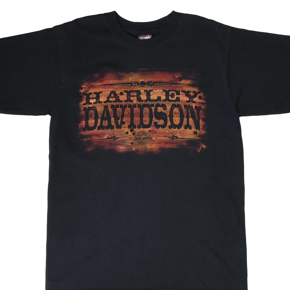 Front of black Harley-Davidson T-shirt with distressed orange and black logo graphic