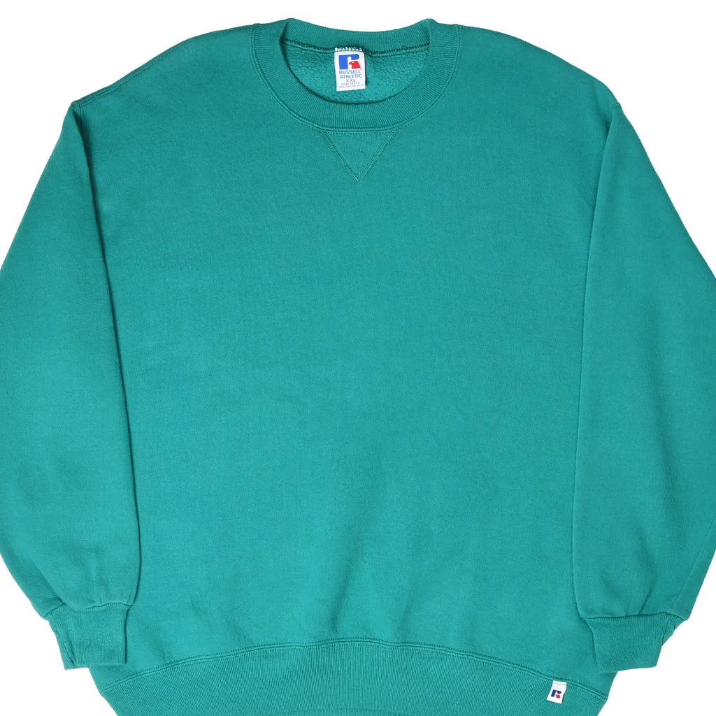 Front of teal Russell Athletic crewneck sweatshirt with ribbed cuffs and hem