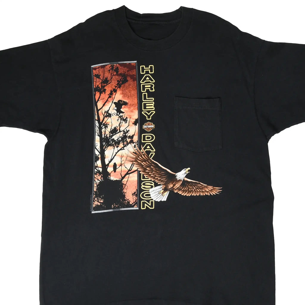 Front of black Harley-Davidson pocket T-shirt with eagle and sunset tree graphic