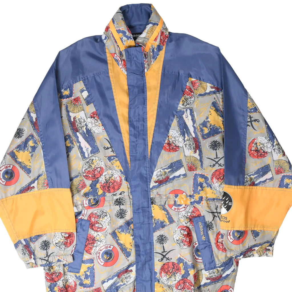 Front close-up of Adidas windbreaker with blue, yellow and multicolor map-print panels