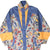 Front close-up of Adidas windbreaker with blue, yellow and multicolor map-print panels