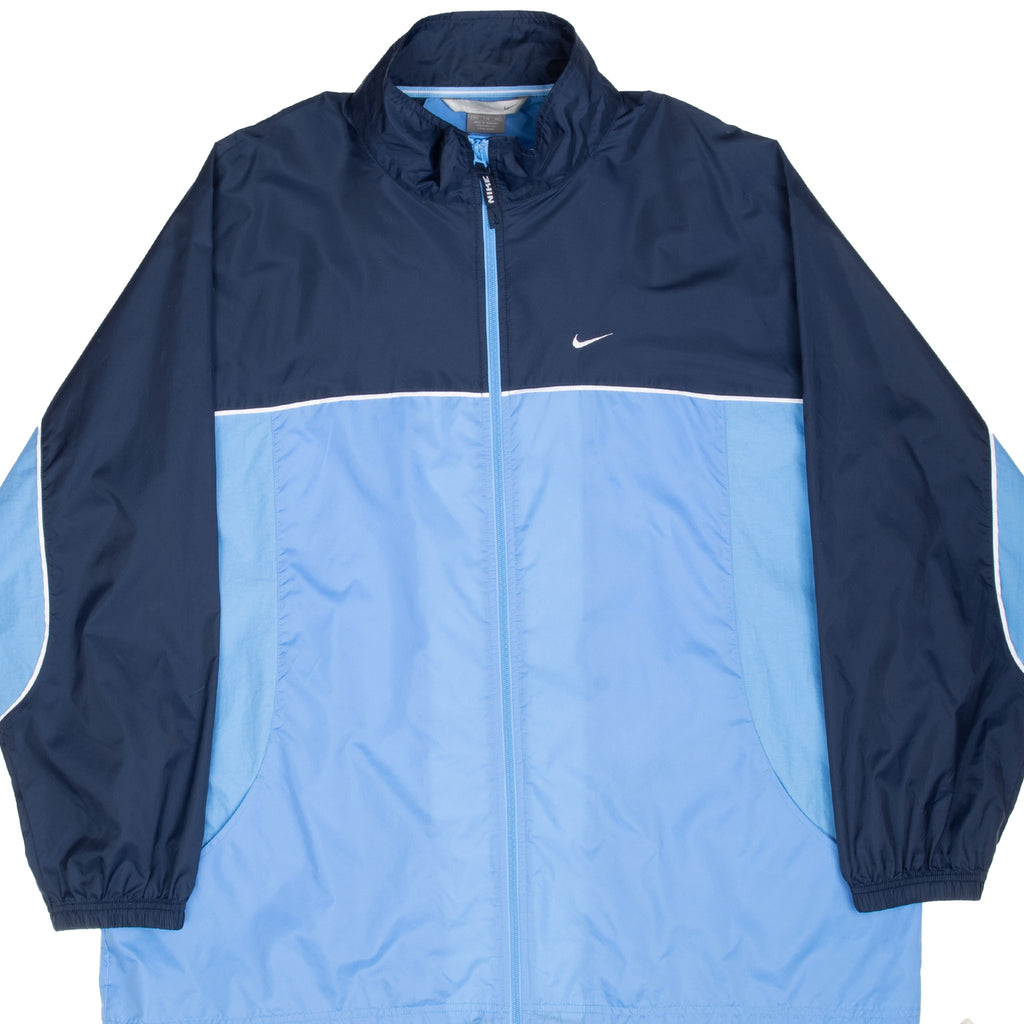 Front of navy and light blue Nike zip-up windbreaker with white Swoosh