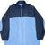 Front of navy and light blue Nike zip-up windbreaker with white Swoosh