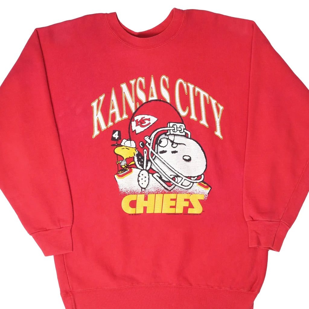 Front of red Kansas City Chiefs sweatshirt with Snoopy and Woodstock football graphic