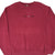 Front close-up of burgundy Nike Air crewneck with centered black lettering and white Swoosh