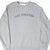 Front of grey Nike sweatshirt with blue Nike Athletics lettering and Swoosh