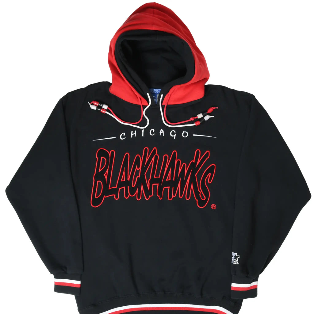 Front of black Chicago Blackhawks Starter hoodie with red double hood and embroidered script