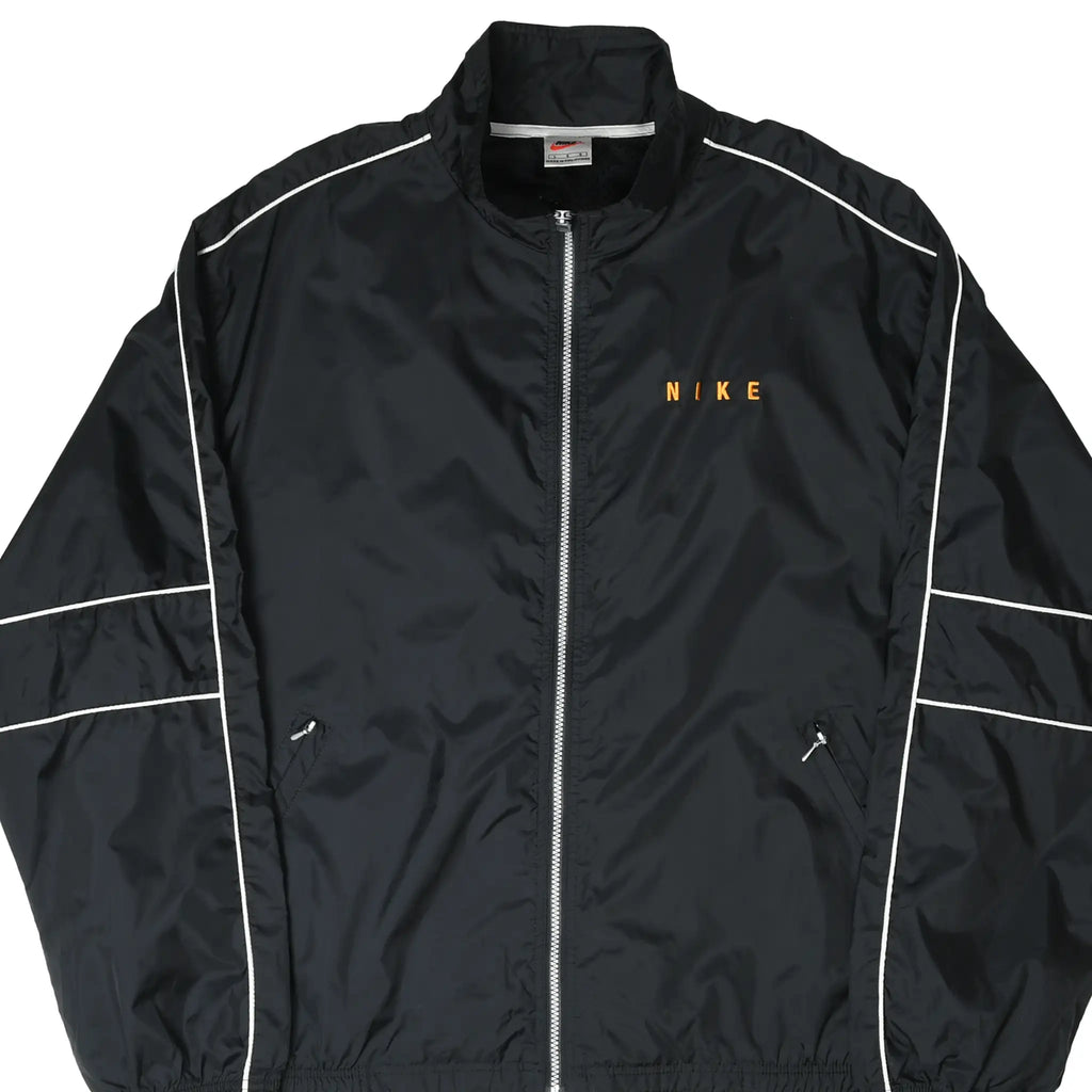 Close front view of black Nike windbreaker with orange chest embroidery, white piping, and zip pockets