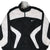 Front close-up of black and white Nike zip-up windbreaker with Swoosh embroidery