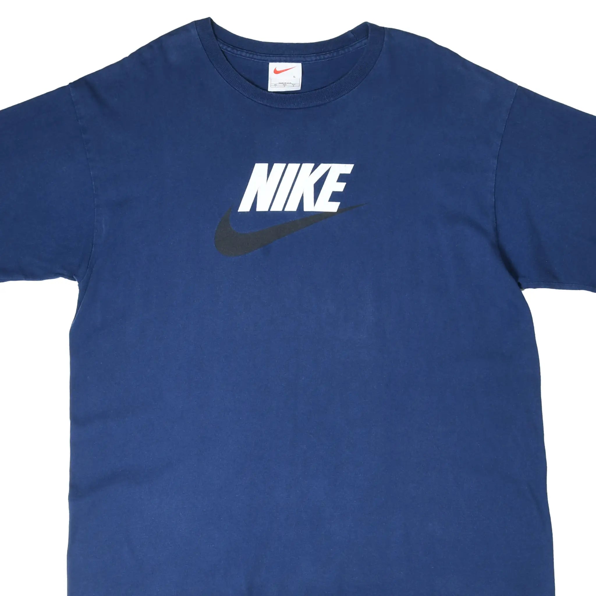 Front upper view of navy Nike T-shirt with white spellout and black Swoosh graphic