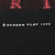 Close-up of Screen Play 1999 copyright text on black fabric