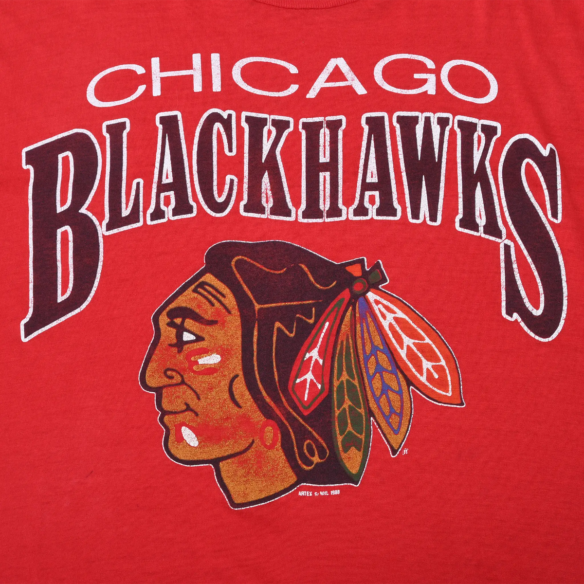 Close-up of Chicago Blackhawks name and multicolor head logo print
