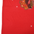 Close-up of red front fabric showing two small holes below the Blackhawks print