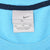Nike neck tag marked XL inside light blue T-shirt