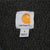 Carhartt neck label and small size tag against black sherpa lining