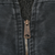 Close-up of Carhartt metal zipper pull and black sherpa lining