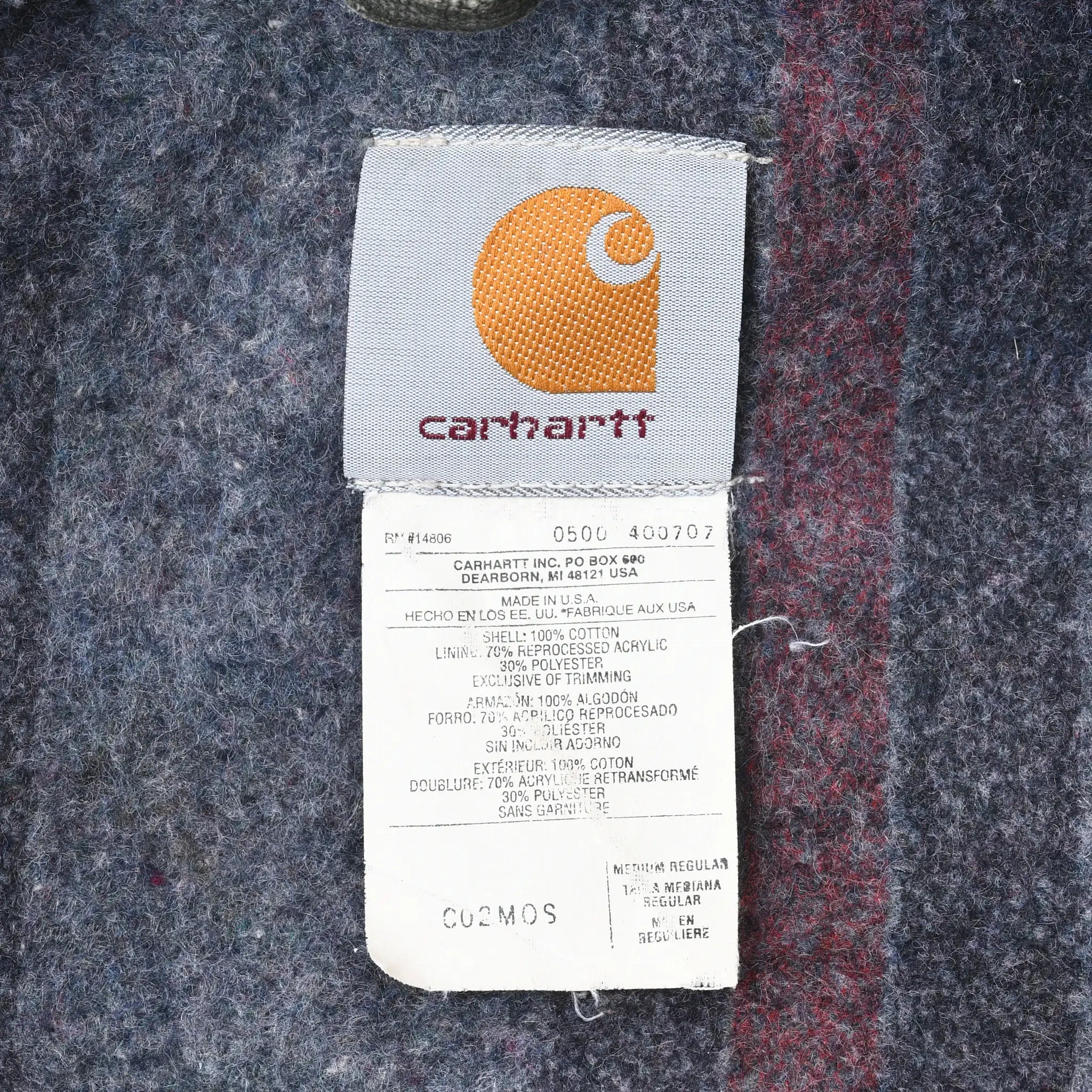 Close-up of Carhartt interior logo and care label showing C02MOS model code