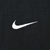 Close-up of white Nike Swoosh embroidery on black fabric