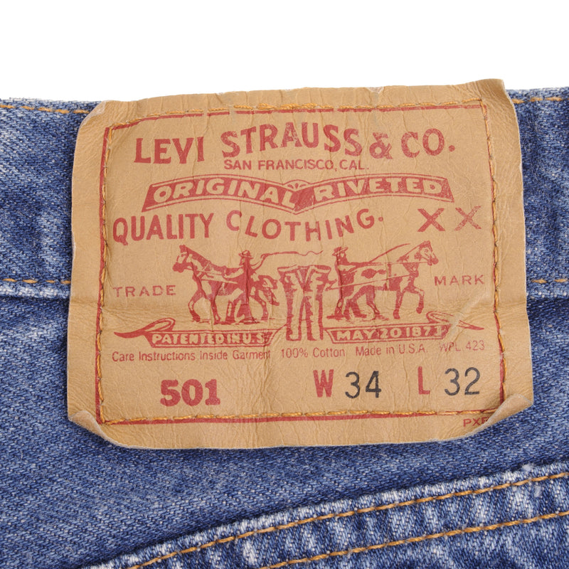 Beautiful Indigo Levis 501 Jeans Made in USA with a medium blue wash  Size on Tag 34X32 Actual Size 33X32 Back Button #544