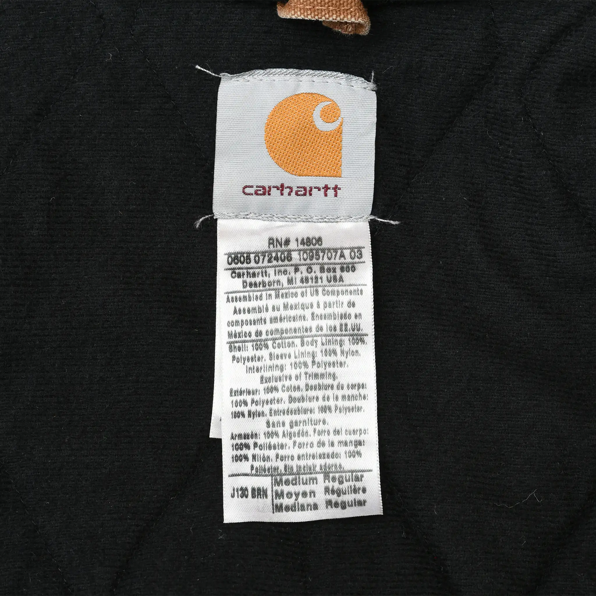 Carhartt interior brand and care labels on black quilted lining
