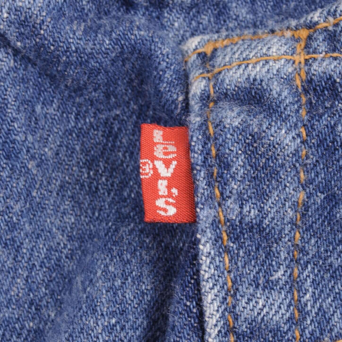 Beautiful Indigo Levis 501 Jeans Made in USA with a medium blue wash  Size on Tag 34X32 Actual Size 33X32 Back Button #544
