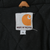 Carhartt Made in the USA interior label with small size tag on black lining