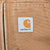 Carhartt logo patch on brown jacket front pocket