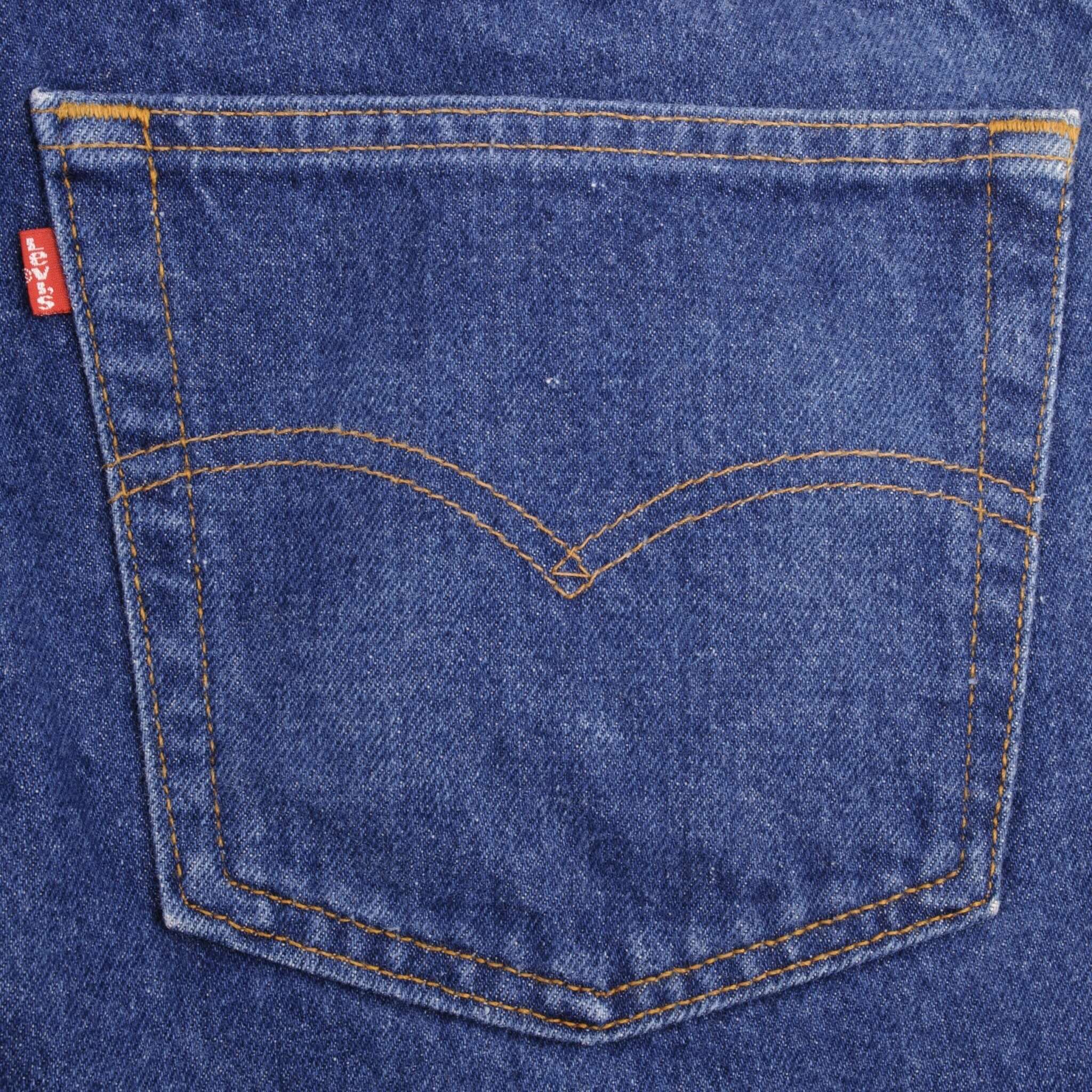Beautiful Indigo Levis 505 Jeans Made in USA with Medium Dark wash, Not Original Hem  Size on Tag 40X32  Actual Size 40X30.5  Back Button #532