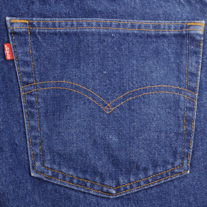 Beautiful Indigo Levis 505 Jeans Made in USA with Medium Dark wash, Not Original Hem  Size on Tag 40X32  Actual Size 40X30.5  Back Button #532