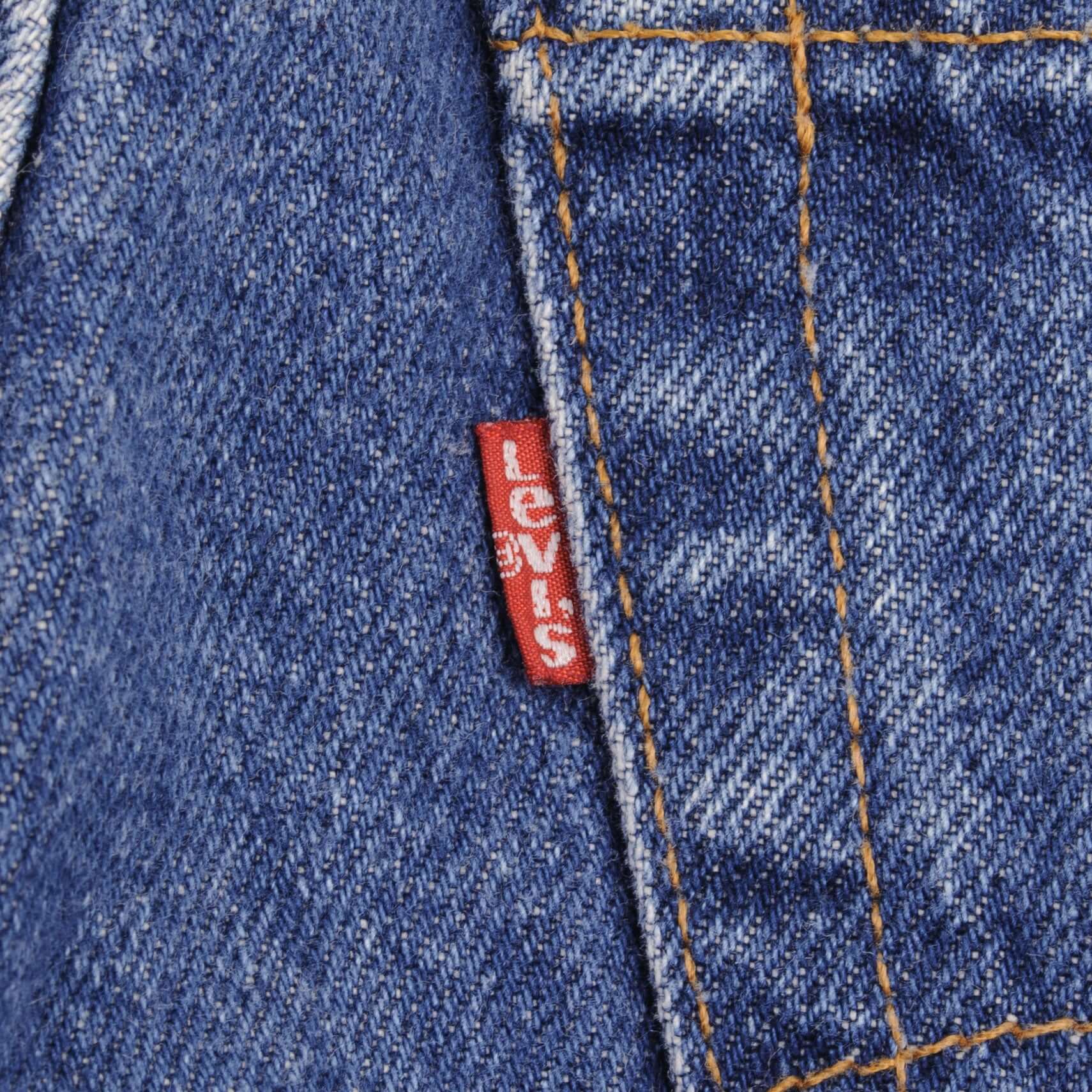 Beautiful Indigo Levis 505 Jeans Made in USA with Medium wash  Size on Tag 33X36  Actual Size 32X36  Back Button #532