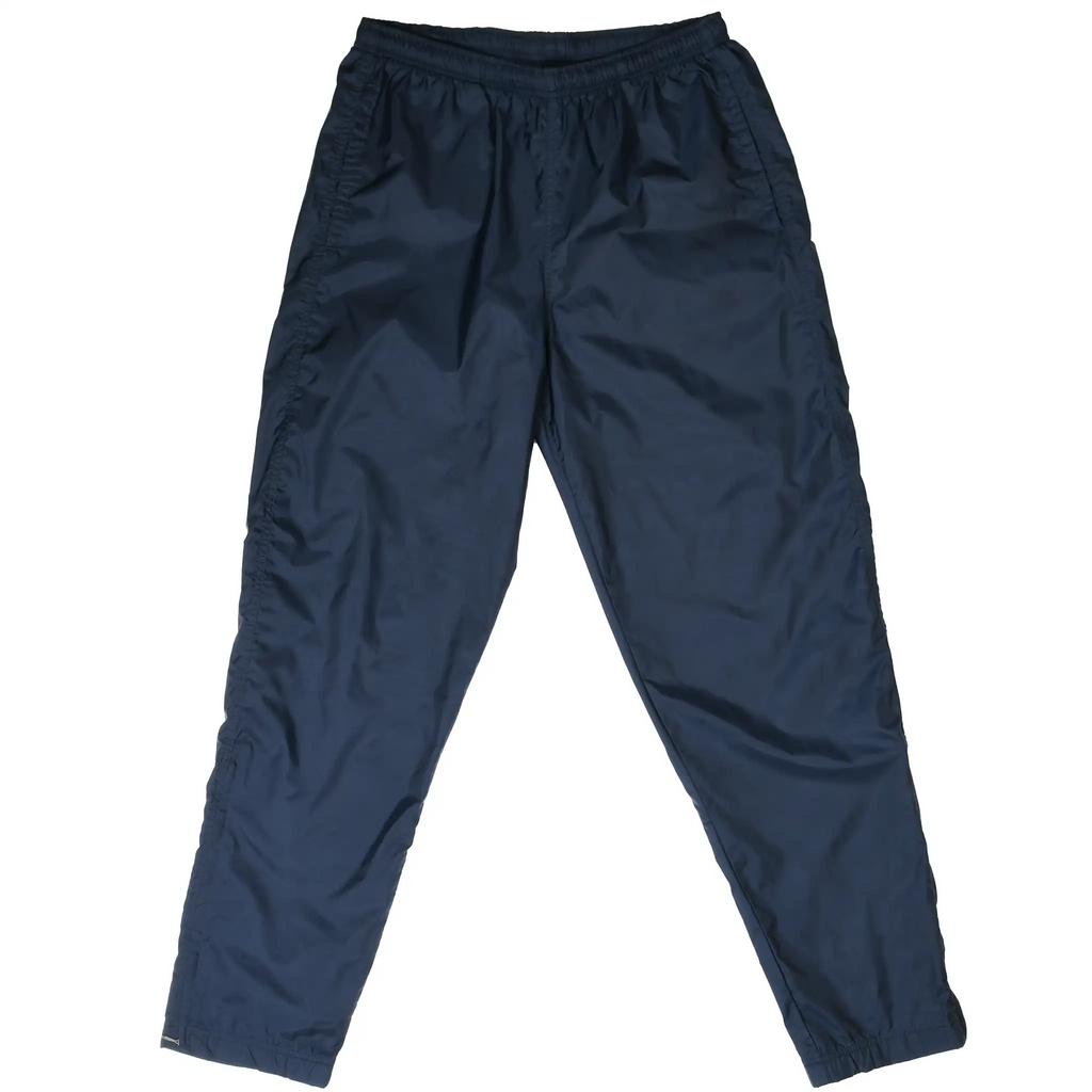 Front of navy blue Nike nylon track pants with elastic waist and cuffs