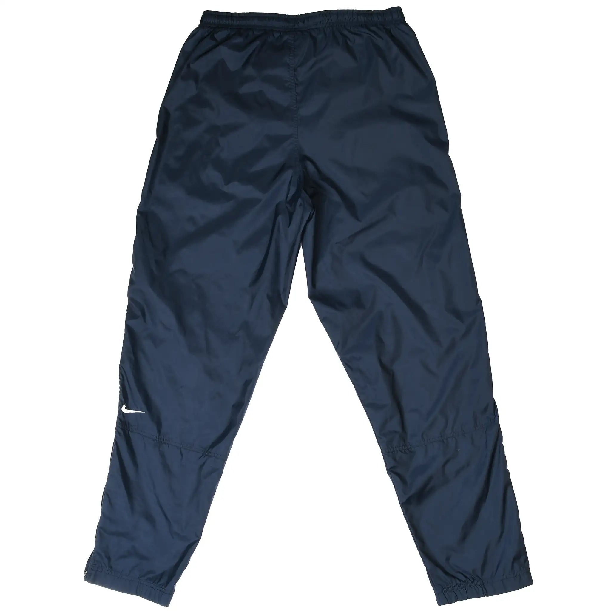 Back of navy blue Nike nylon track pants with white Swoosh embroidery on leg
