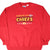 Front of red Majestic Kansas City Chiefs sweatshirt with embroidered NFL team logo