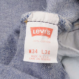 Beautiful Indigo Levis 501 Jeans 1990s Made in USA with Medium Wash   Size on tag 34X34 Actual Size 34X29 1/2 Back Button #553 Not Original Hem