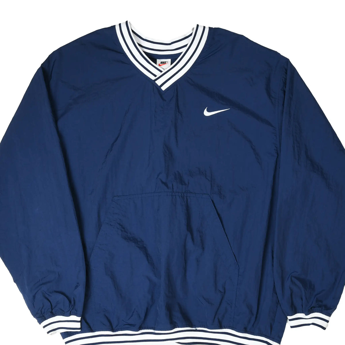 Front of navy Nike pullover windbreaker with white Swoosh, striped V-neck trim, and kangaroo pocket