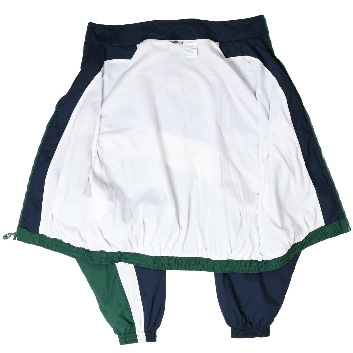 Open Reebok windbreaker showing white interior lining and navy and green outer panels