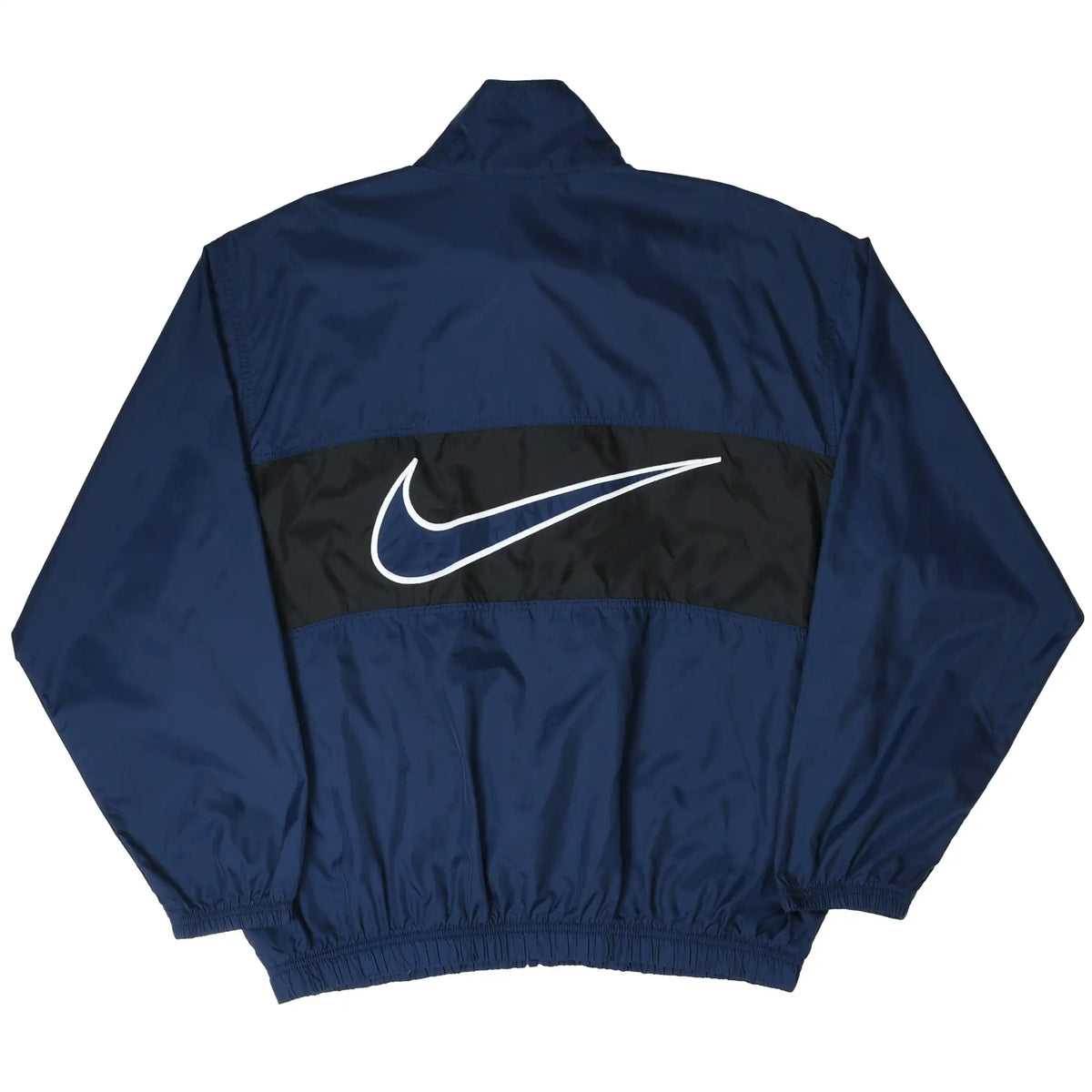 Back of navy Nike windbreaker with oversized outlined Swoosh on black panel