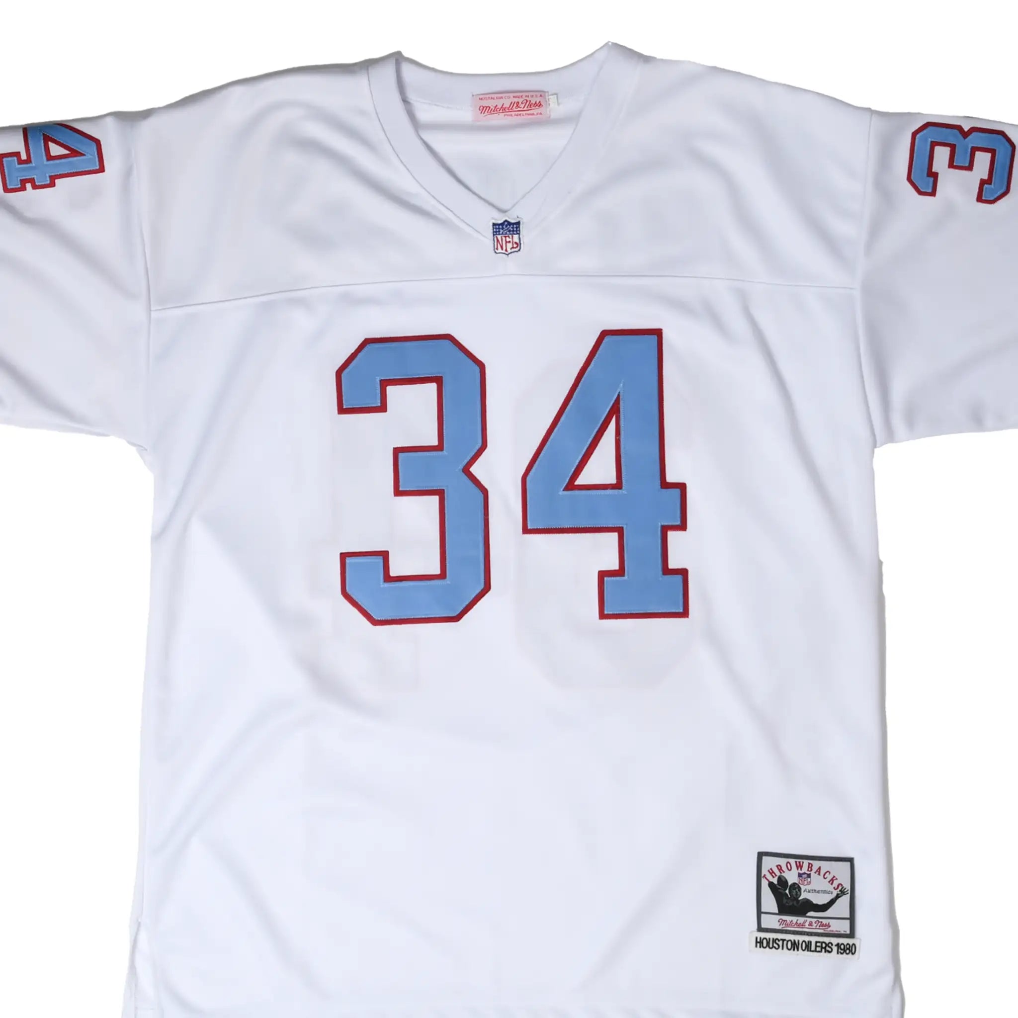Front close-up of white Houston Oilers Earl Campbell #34 Mitchell & Ness jersey