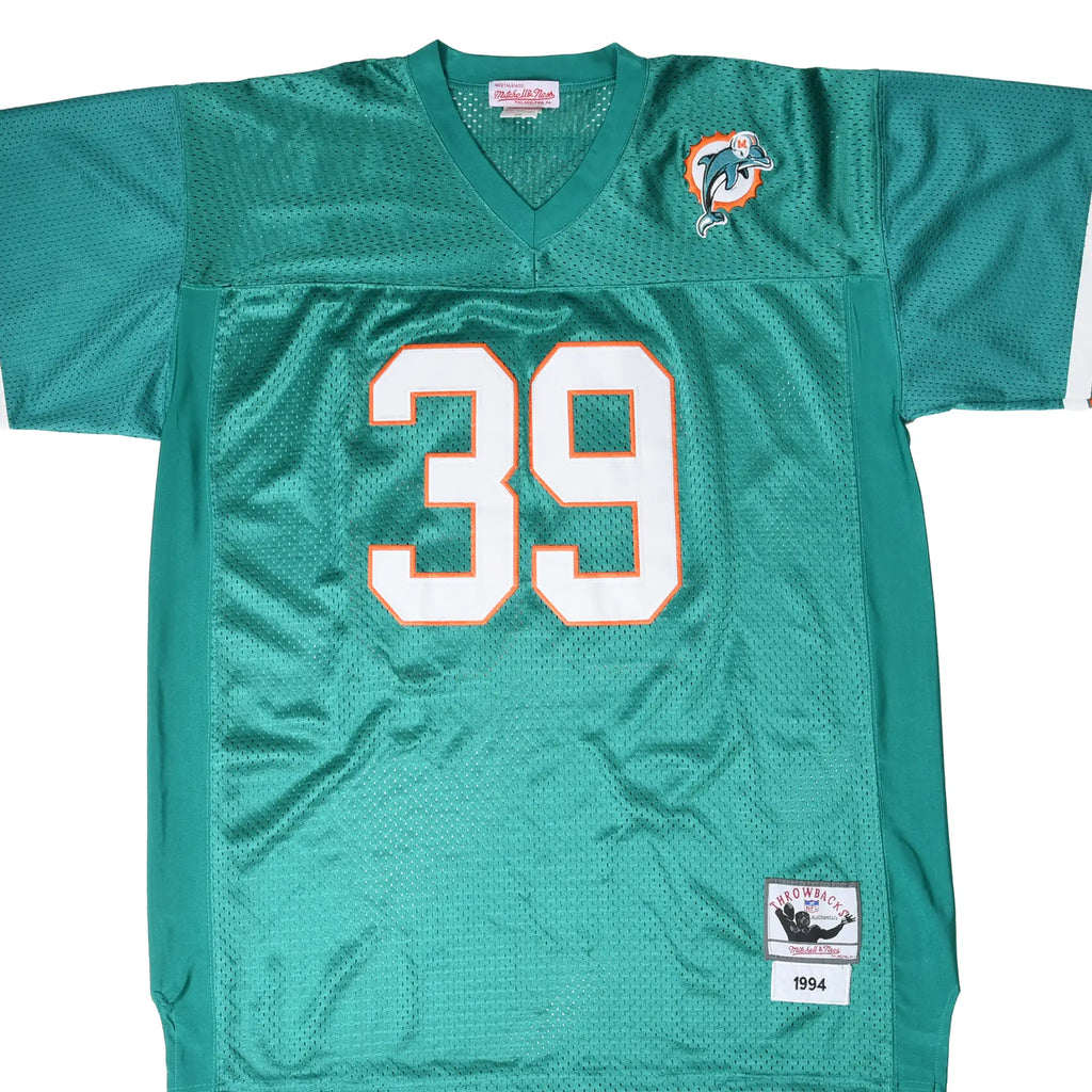 Front of aqua Miami Dolphins Mitchell & Ness jersey with white number 39 and team logo