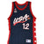 Front of navy Champion Team USA basketball jersey with USA graphic, number 12, and red star side panels