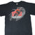 Front of black Nike T-shirt with Michael Jordan's The Restaurant basketball and building graphic