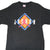 Front of black Nike T-shirt with white Jordan lettering and pink Jumpman over an orange and blue diamond