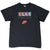 Full front view of black Nike P.L.A.Y. T-shirt with multicolor chest print and red Swoosh logo