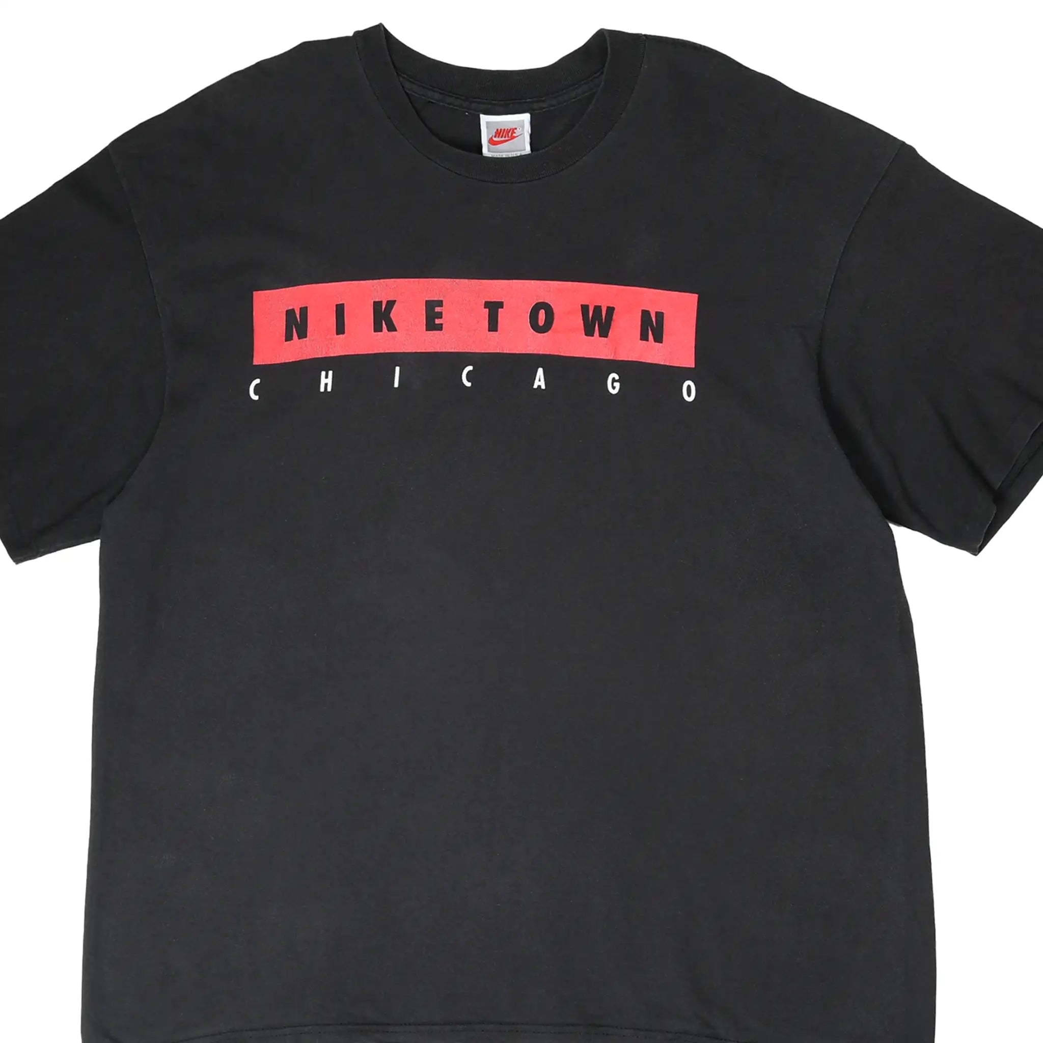Front of black Nike Town Chicago T-shirt with red and white chest graphic